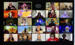 Zoom grid with 25 people, some with 1970s backgrounds and dancing