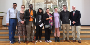 Image shows Dr. Jonathan Lazar (far right) lined up alongside members of his class and Dr. Raja Kushalnagar (far left) during their trip to Gallaudet University.