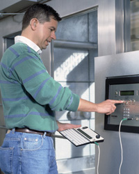 A man using an accessible kiosk